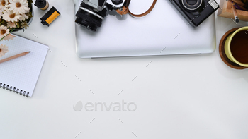 notebook, camera, accessories and copy space on white table.