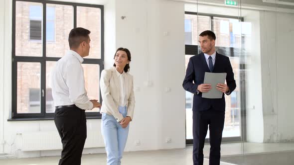 Realtor Showing New Office Room To Customers