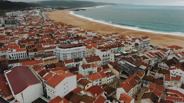 Aerial View of Small Town with Bright Buildings Near Ocean