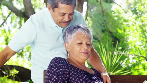 Senior couple kissing each other in garden