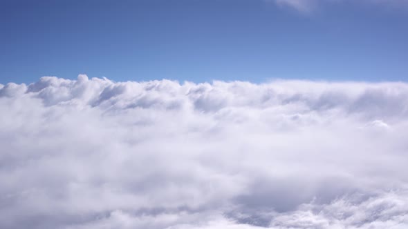 White Thick Clouds Float Across the Blue Sky