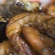 Pouring Sauce on Pile of Grilled Royal Prawns and Mussels - VideoHive Item for Sale
