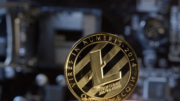 Litecoin Spinning on Computer Motherboard Background Cryptocurrency Mining Virtual Money
