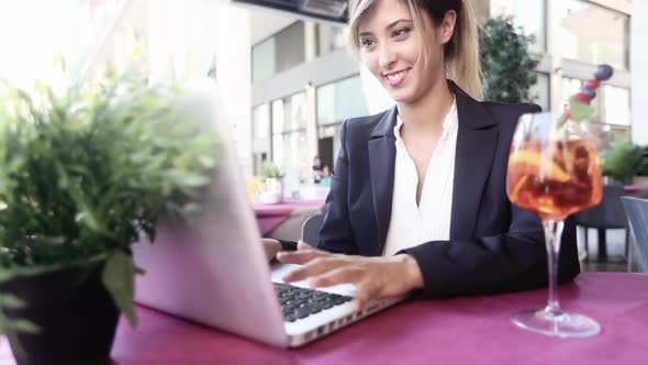 Businesswoman Using Laptop during a Break