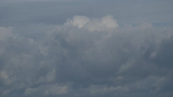 Grey Clouds Blown By The Wind In Blue Sky - close up, time lapse