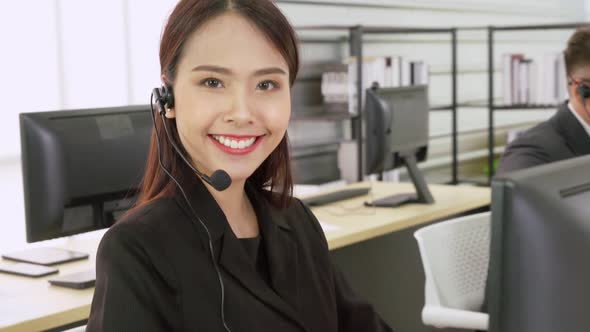 Business People Wearing Headset Working in Office