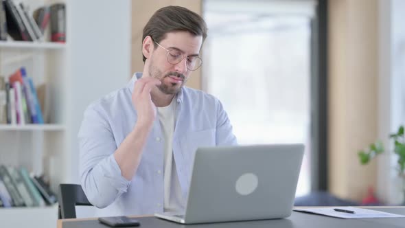 Man in Glasses with Laptop Having Neck Pain