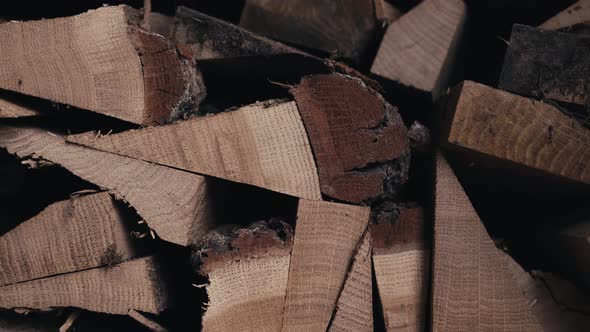 Smooth Departure From the Oak Firewood Harvested for the Winter Stacked in a Wood Log