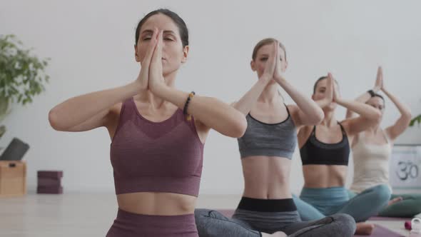 Group of Four Women Practicing Yoga