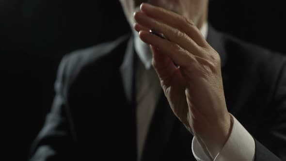 Man Making Hand Trick With Coin, Using Financial Schemes, Money Laundering