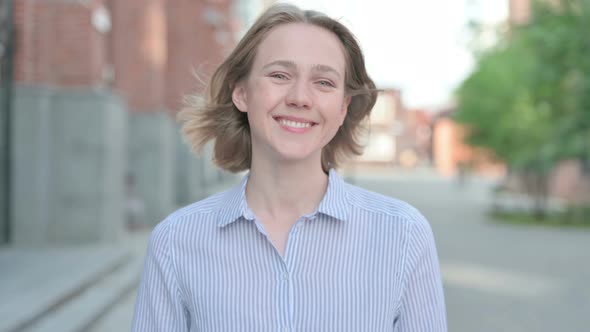 Portrait of Woman Shaking Head As Yes Sign Approval