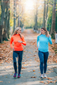 Women Running in Public Park in the Fall. - PhotoDune Item for Sale