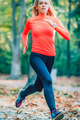 Woman Running in Public Park in the Fall. - PhotoDune Item for Sale