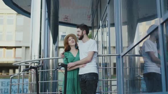 The Couple in Love Stands in Embraces Together and Has Pleasant Talk at Building