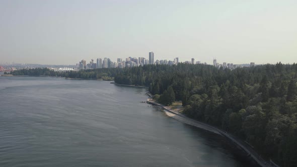 Wide shot of Vancouver skyline and Stanley park from Lions gate bridge