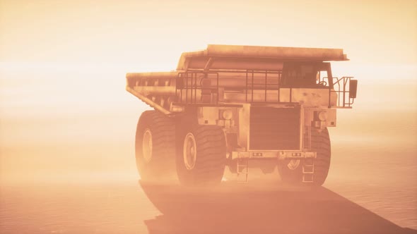 Big Yellow Mining Truck in the Dust at Career