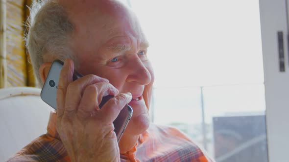 Close-up of Caucasian senior man talking on mobile phone 4k