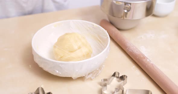 Woman making Christmas cookies at home 