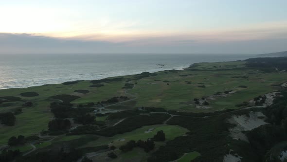 Luxury Links Golf Course on West Coast of Oregon at Sunset - Aerial with Copy Space in Sky