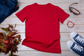 Mens red T-shirt mockup with wild grass and bracelet - PhotoDune Item for Sale