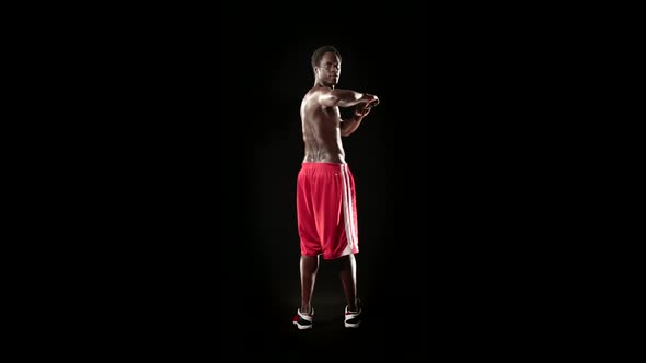 Man Stretching Isolated on Black