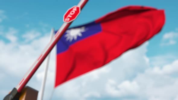 Barrier Gate Being Closed with Flag of Taiwan As a Background