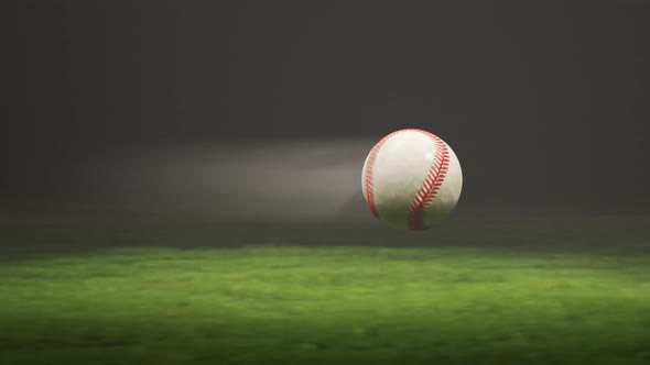 Baseball flying fast through the air in slow motion above the stadium grass 4KHD