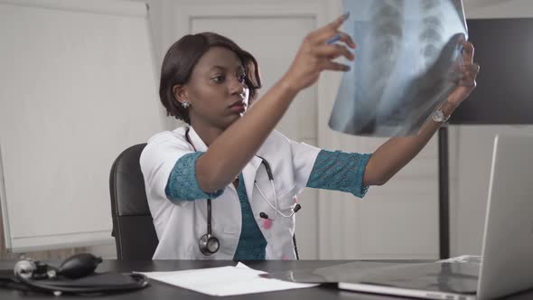 Beautiful African American Healthcare Worker with X-ray, Medical International Concept, Black Doctor