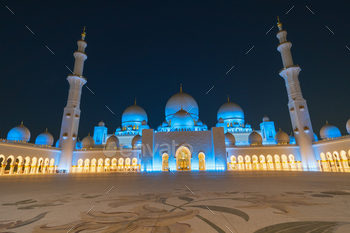 habi, United Arab Emirates. The third biggest mosque in the world.  Night view with blue and yellow neon lighting.