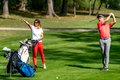 Young couple playing golf on a beautiful summer day - PhotoDune Item for Sale