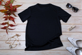 Womens black T-shirt mockup with white heels and grass - PhotoDune Item for Sale
