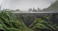 Reynisfjara black sand beach and Reynisdrangar basalt sea stacks on story day, Vik, Iceland - PhotoDune Item for Sale