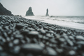 Stones on a black beach on moody day in Iceland - PhotoDune Item for Sale