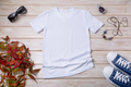 Womens white T-shirt mockup with blue sneakers - PhotoDune Item for Sale