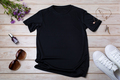 Womens black T-shirt mockup with burdock flowers - PhotoDune Item for Sale