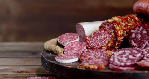 Different Types of Sliced Salami Slowly Rotate. 