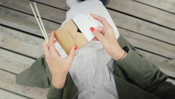 Woman Eat Take Away Wok Noodles From Box