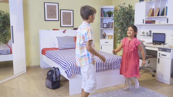 Girl and boy playing at home.