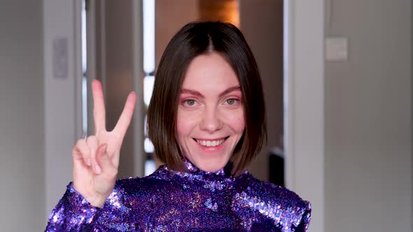 Woman Stylish Purple Dress Shows Gestures Peace V OK