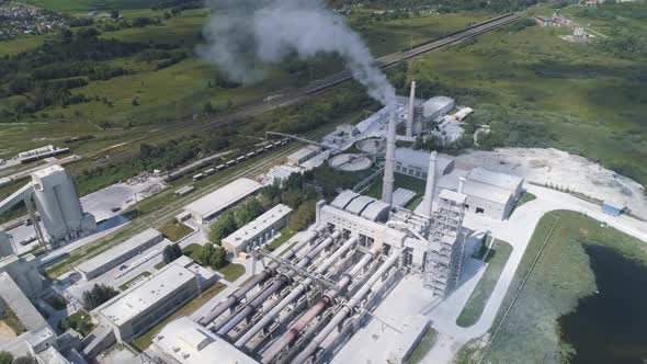 Cement Factory, Industrial Enterprise. The Smoking Factory Chimney.