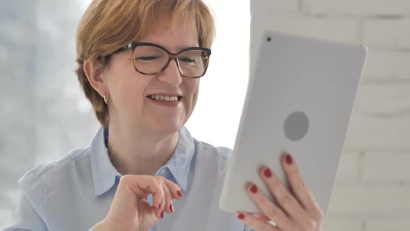 Online Video Chat Old Woman Via Tablet