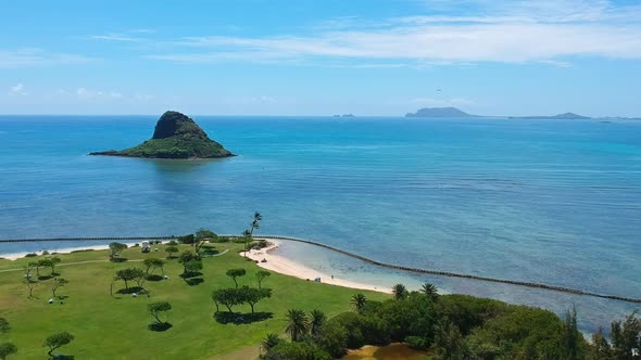 Aerial view of Kualoa Regional Park overlooking Chinaman's hat on Oahu