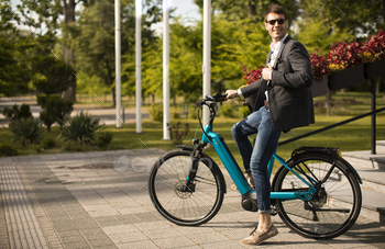 Young businessman on the ebike