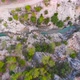Flight Over a Mountain River and a Trail to a Gorge Among a Coniferous Forest - VideoHive Item for Sale
