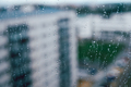 Raindrops on a window against some buildings - PhotoDune Item for Sale