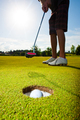 Closeup wideangle shot of a golf player playing a Par - PhotoDune Item for Sale