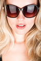 studio closeup portrait of a young beautiful woman in vintage sunglasses - PhotoDune Item for Sale