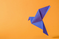 blue dove of peace on an orange background is flying as a poster - PhotoDune Item for Sale