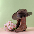 Cowboy boots shoes and hat and bouquet of rose flowers on green background - PhotoDune Item for Sale