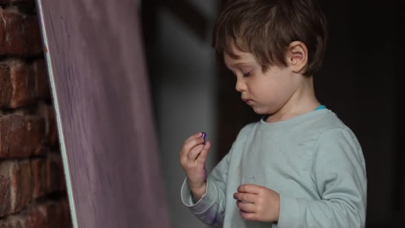 Little boy draw on desk at home
